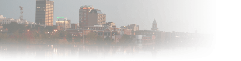 A blurry photo of buildings and water